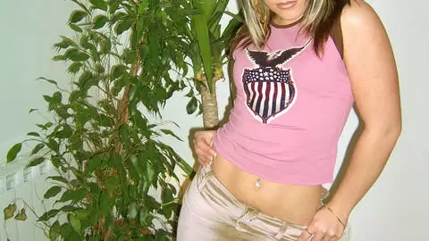 Little blonde removing her clothes on a couch