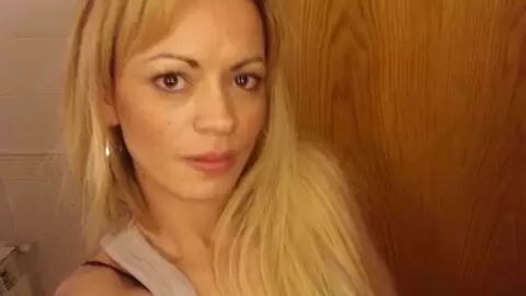 Blonde doing a strip  photo 10