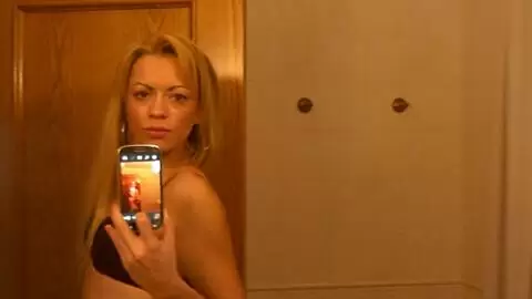 Blonde doing a strip  photo 15