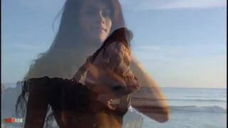 Latin geting nude by the beach