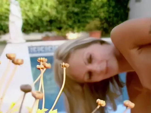Petite blonde star du porno doing a strip at the pool photo 14
