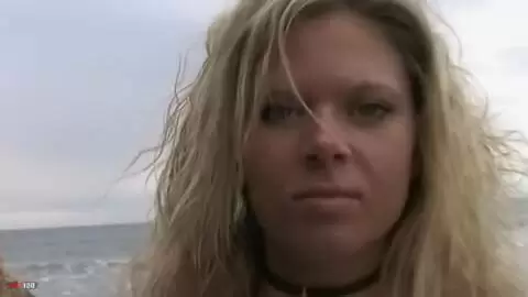 Pretty blonde with big boobs Electra doing a strip on the beach  photo 01