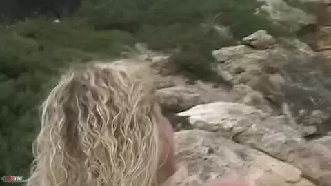 Pretty blonde with big boobs Electra doing a strip on the beach  photo 13