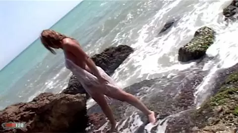 Blonde geting naked at the beach photo 05