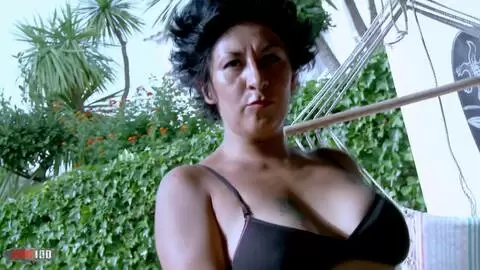 Mature geting nude by the pool