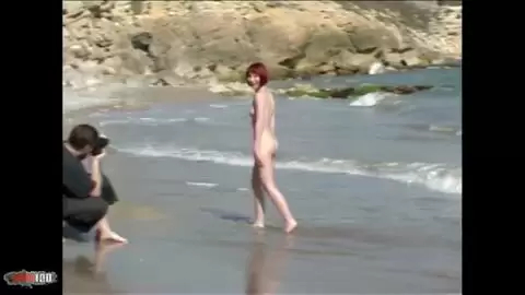 Lovely redhead Mahylis doing a strip on the beach  photo 10