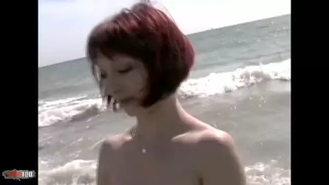 Lovely redhead Mahylis doing a strip on the beach  photo 11