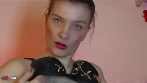 Brunette touching herself on a couch