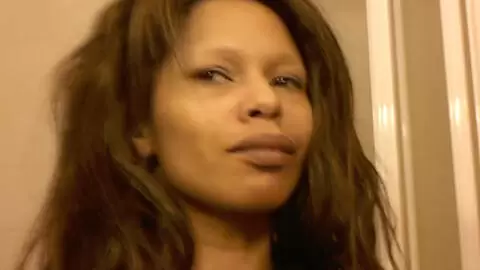 Black removing her clothes  photo 2