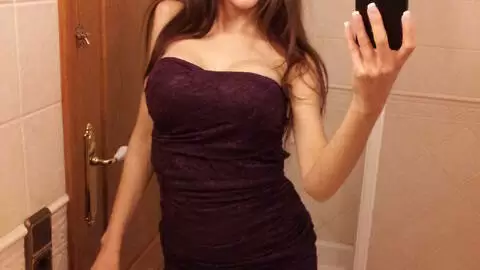 Brunette removing her clothes 