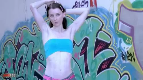 Die junge Französin Pauline Cooper macht einen Striptease vor einer Tag-Wand photo 01