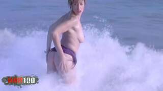 Blonde playing by the beach